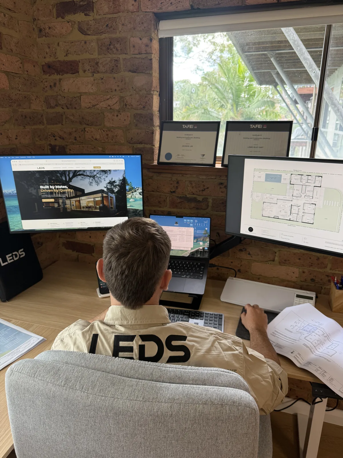 Drafting plans at the LEDS office