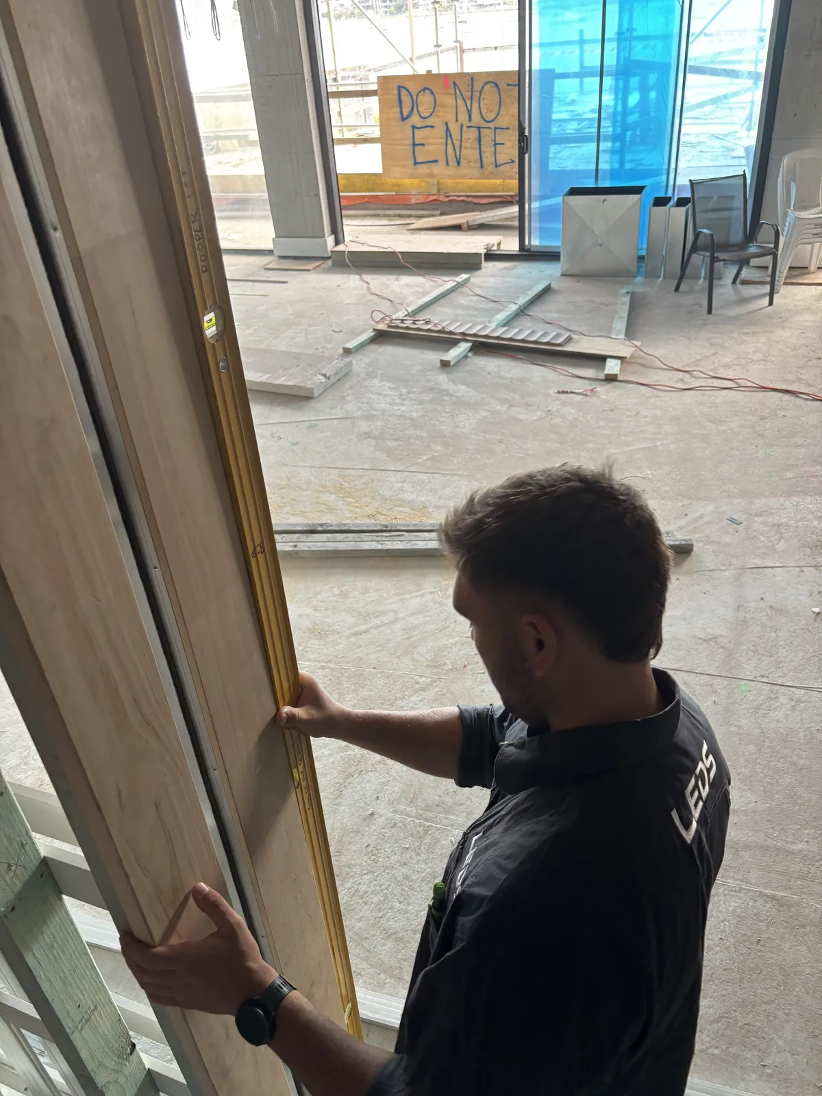 Checking a door frame is plumb