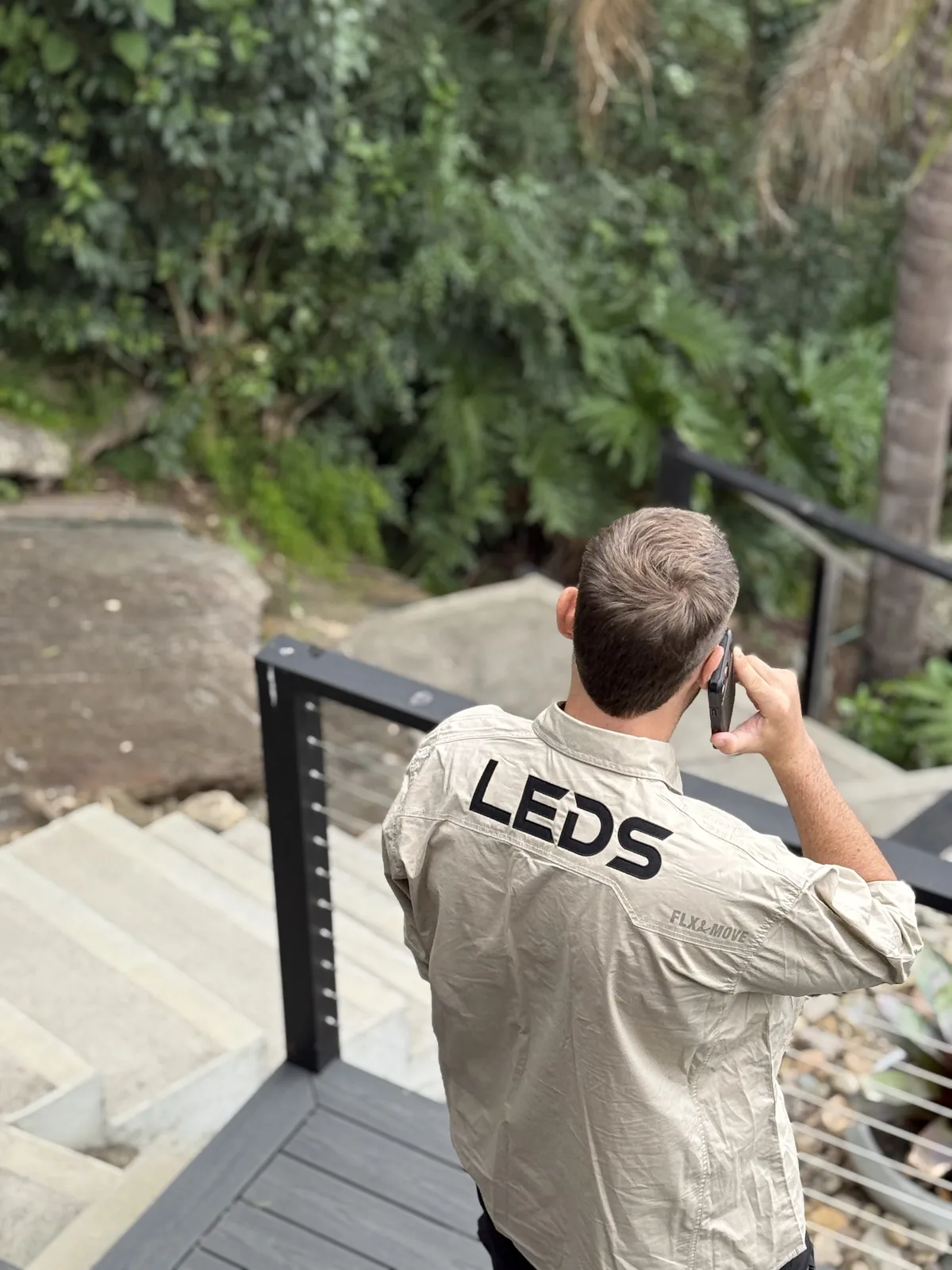 Site lead overseeing the job from the stairs